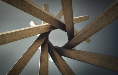 A photo by Todd Trapani of a modern art sculpture made of interlocking concrete beams