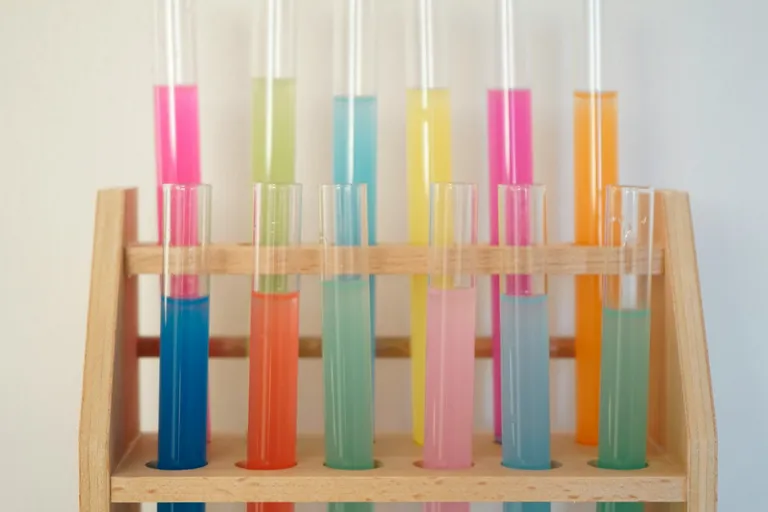 A photo by Vedrana Filipović of a rake of test tubes containing coloured liquids.